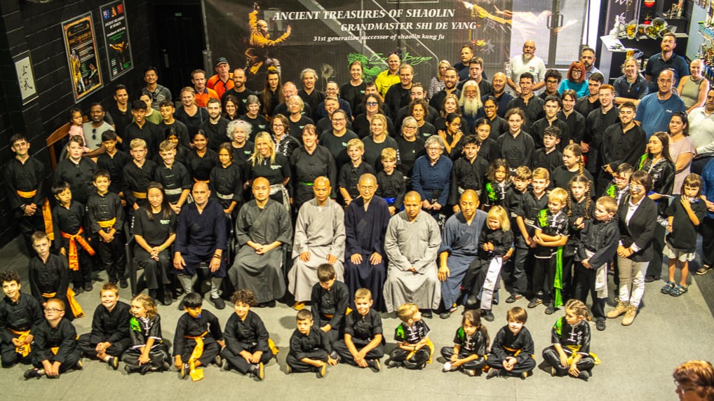 Group photo of Shaolin Kung Fu students of all ages at Emerald Dragon Martial Arts